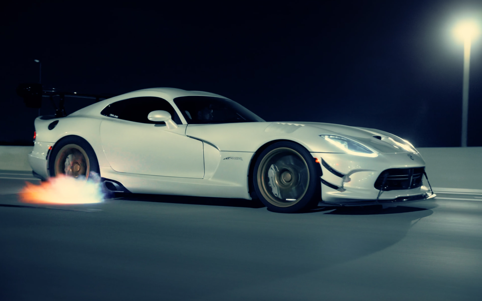 White Dodge Viper ACR at night with exhaust flame